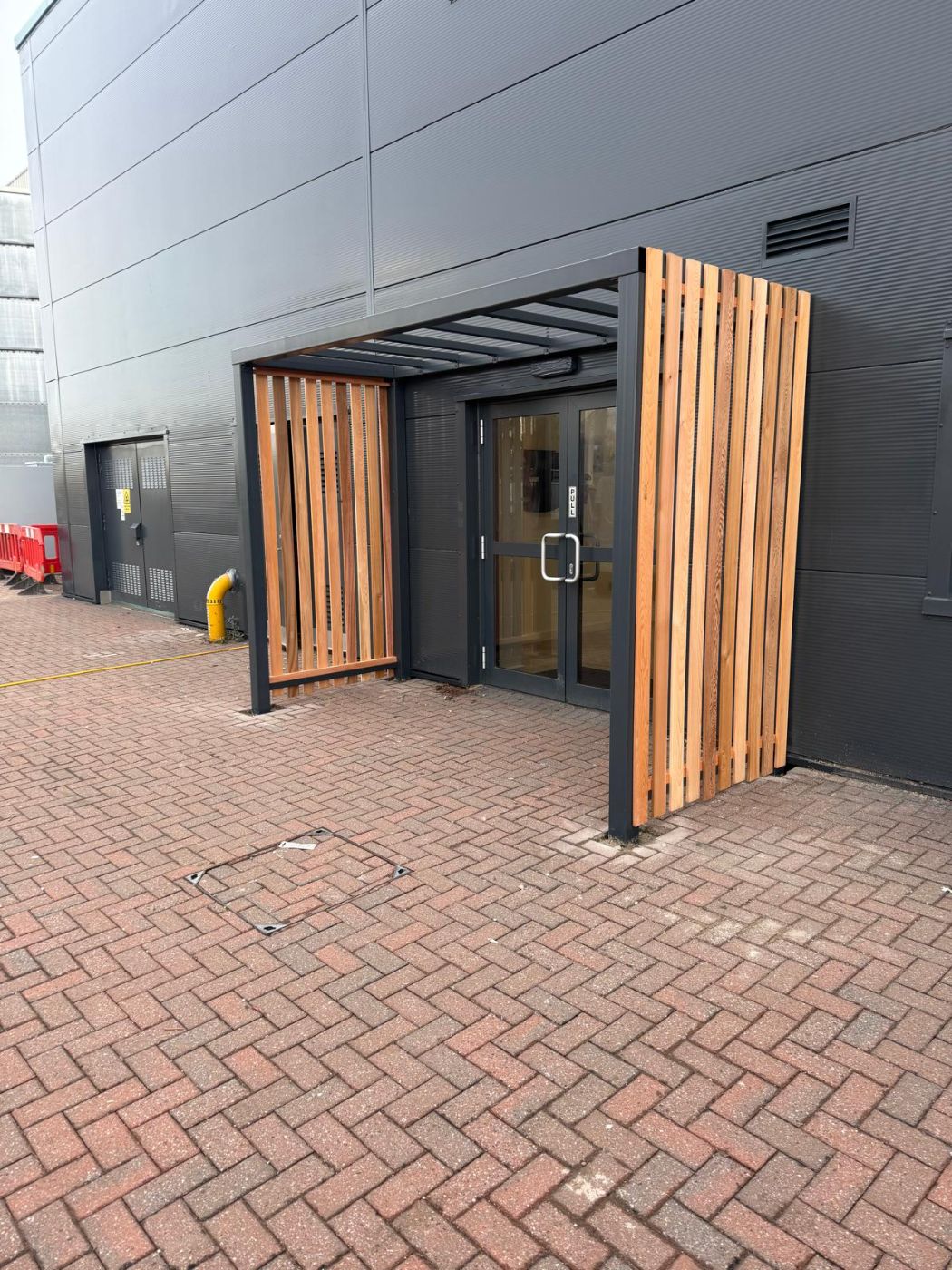 Steel and cedar entrance canopy